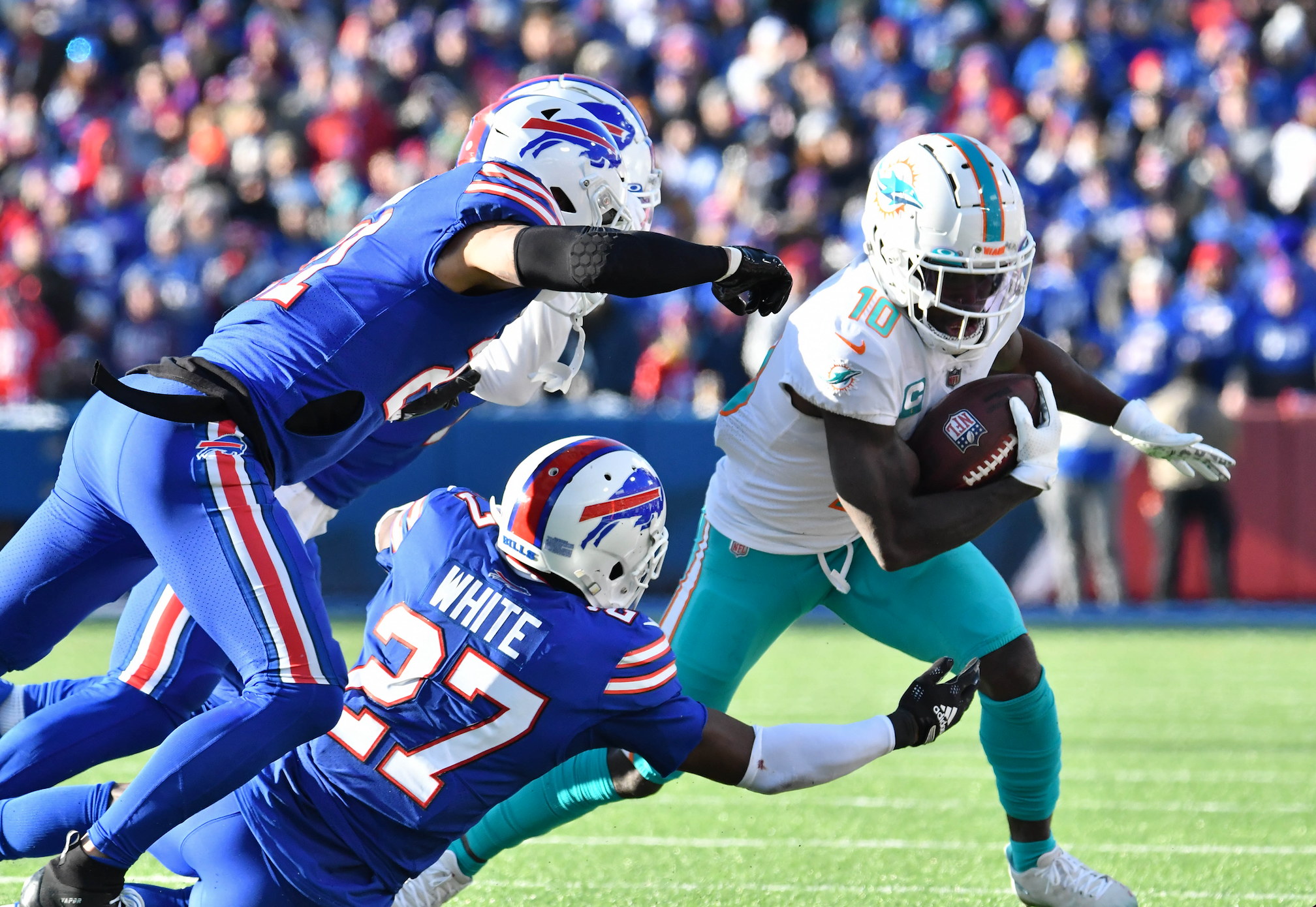 Jaguars' defensive end Josh Allen squishes the Miami Dolphins